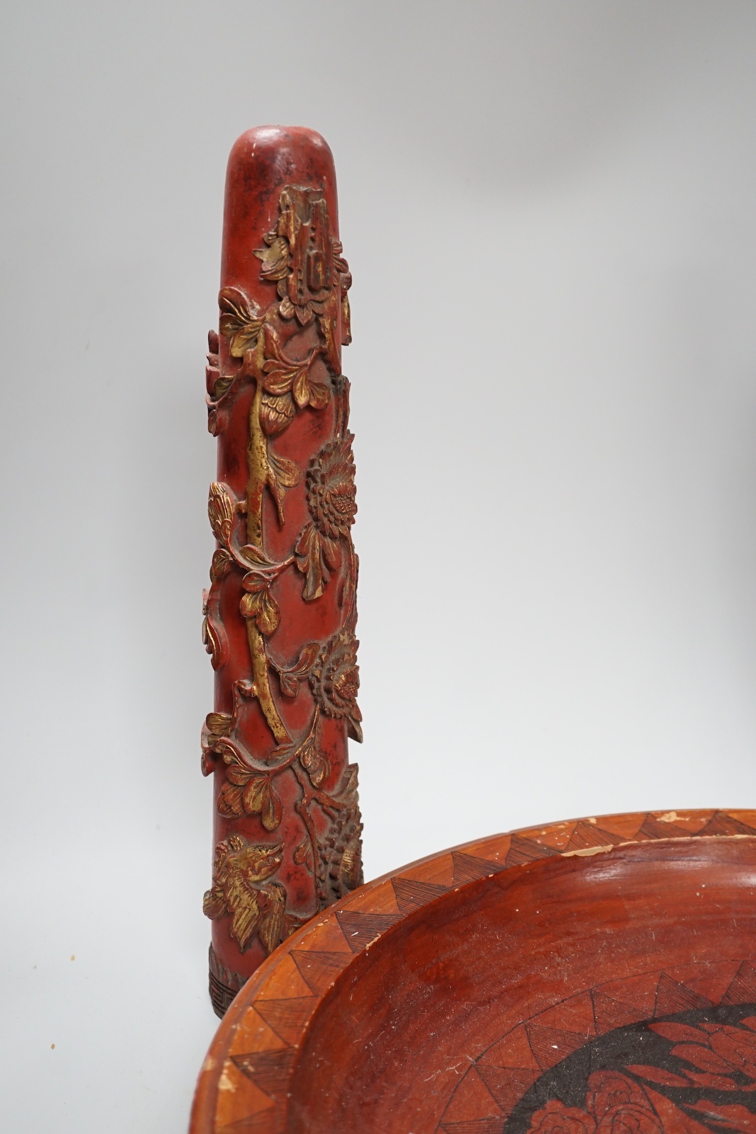 A pair of early 20th century Chinese carved red lacquer and gilt temple incense burners and a similar Asian lacquer dish, dish 44.5cms diameter